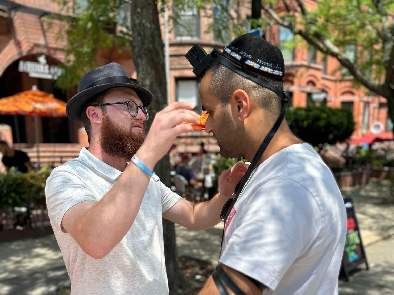 Putting on tefillin on the streets of Brighton, Boston